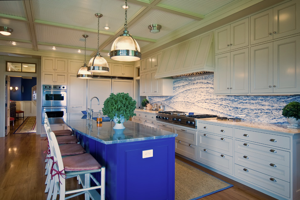 Inspiration for a mid-sized eclectic single-wall eat-in kitchen in Boston with a single-bowl sink, beaded inset cabinets, blue cabinets, granite benchtops, multi-coloured splashback, stone slab splashback, stainless steel appliances, medium hardwood floors and with island.