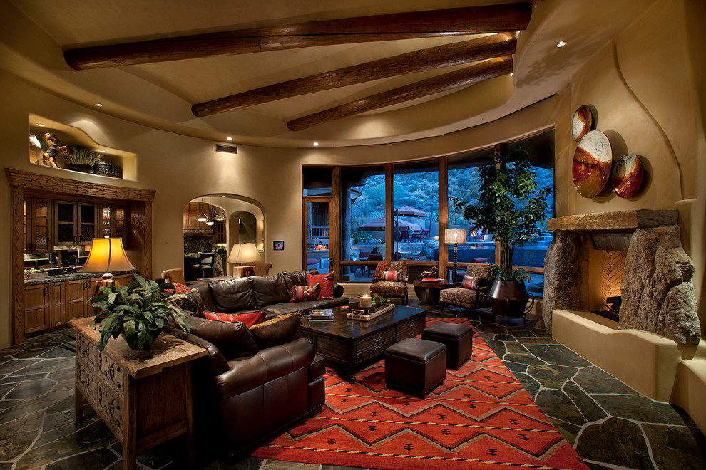 This is an example of a traditional living room in Phoenix with slate floors and grey floor.