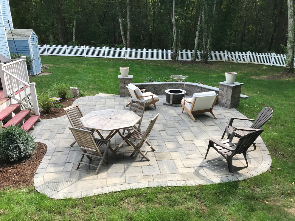 Inspiration for a small timeless backyard concrete paver patio remodel in Providence with no cover