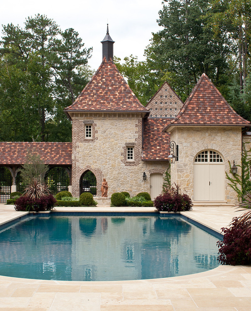 Inspiration for a traditional two-storey exterior in Atlanta with stone veneer.