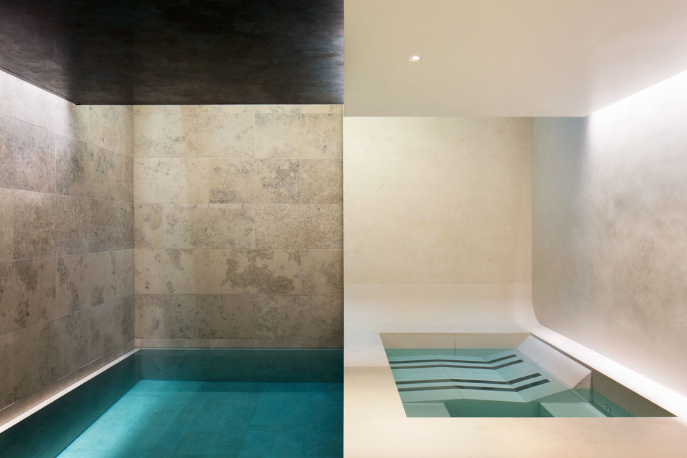 Inspiration for a large contemporary indoor rectangular lap pool in London with a hot tub.
