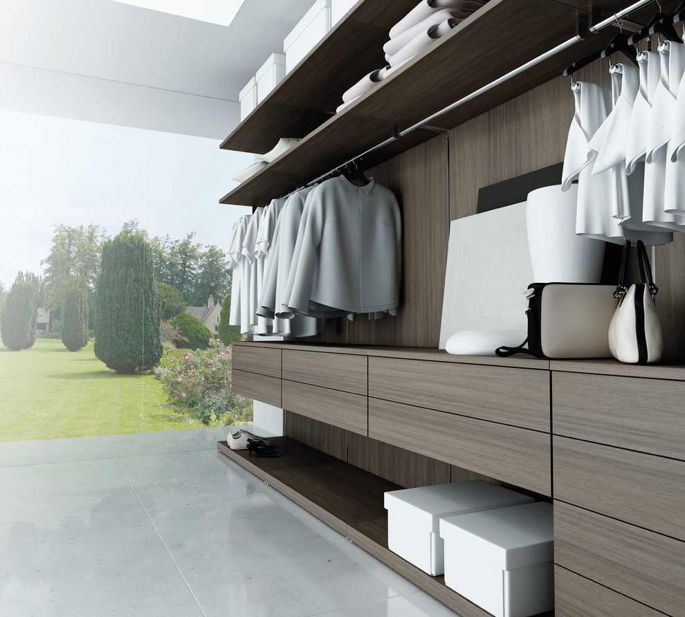 Photo of a mid-sized modern walk-in wardrobe in New York with open cabinets and light wood cabinets.