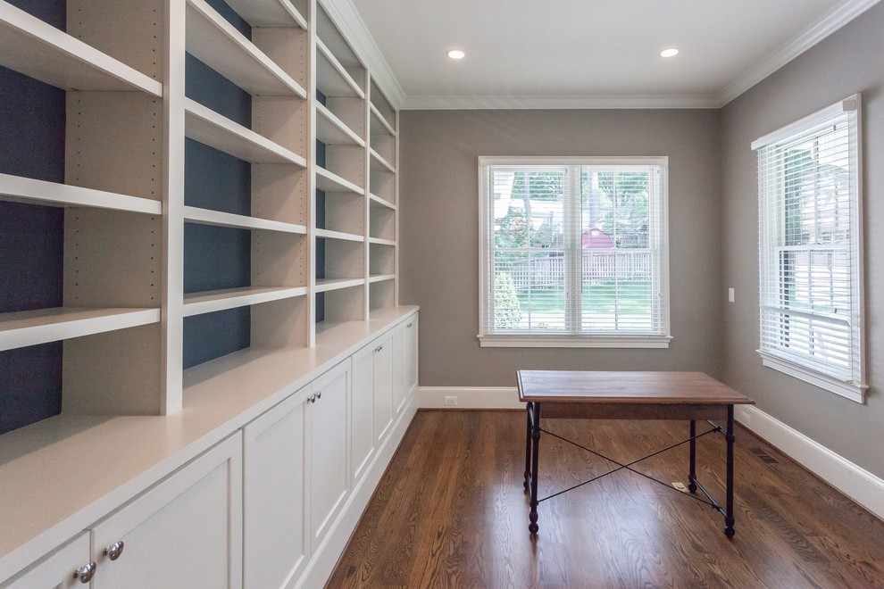 Home design - transitional freestanding desk medium tone wood floor and brown floor home design idea in DC Metro with beige walls
