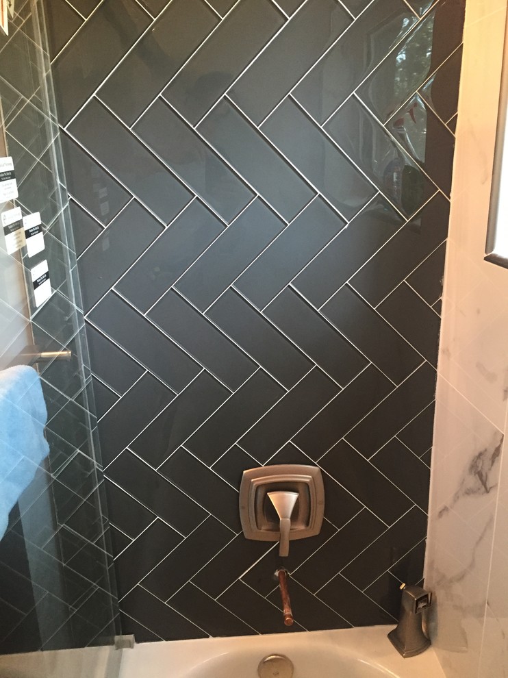 Mid-sized traditional bathroom in Chicago with an alcove shower, a two-piece toilet, white tile, gray tile, an alcove tub and glass tile.
