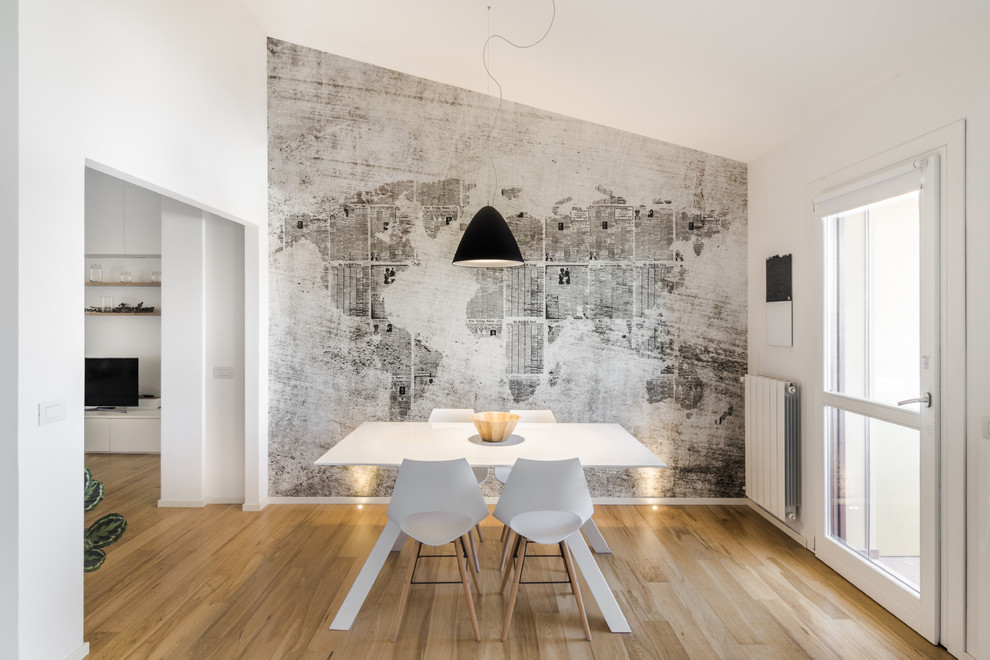 Design ideas for a mid-sized contemporary open plan dining in Cagliari with multi-coloured walls, medium hardwood floors, no fireplace and brown floor.