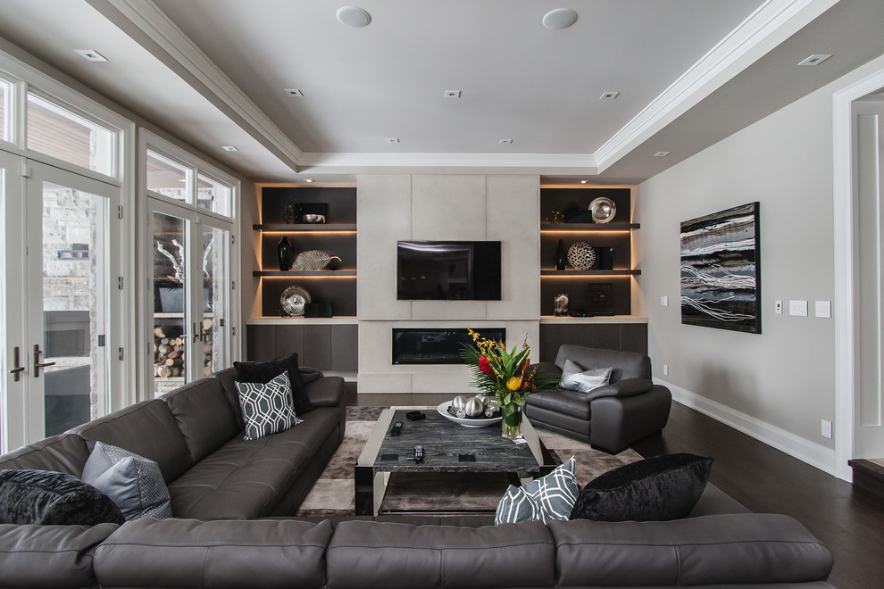 Transitional living room in Toronto with a wall-mounted tv.