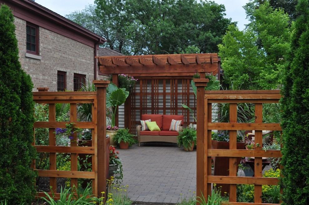 Photo of a traditional patio in Chicago with a pergola.