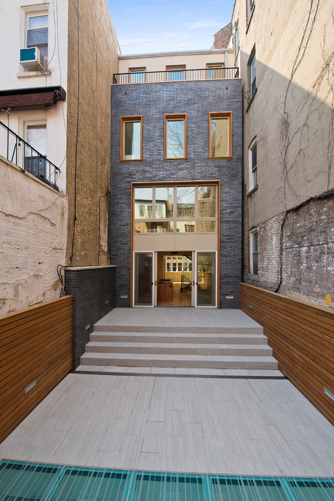 This is an example of a contemporary three-storey exterior in New York.