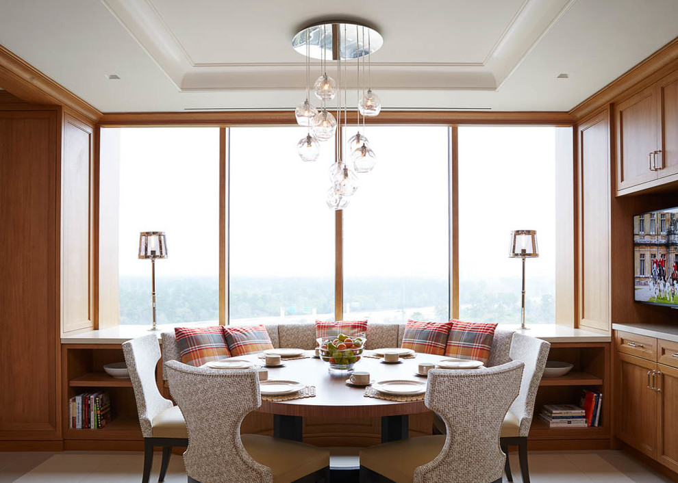 Example of a transitional dining room design in Houston with an undermount sink, recessed-panel cabinets, medium tone wood cabinets, quartz countertops, multicolored backsplash, mosaic tile backsplash, stainless steel appliances and an island