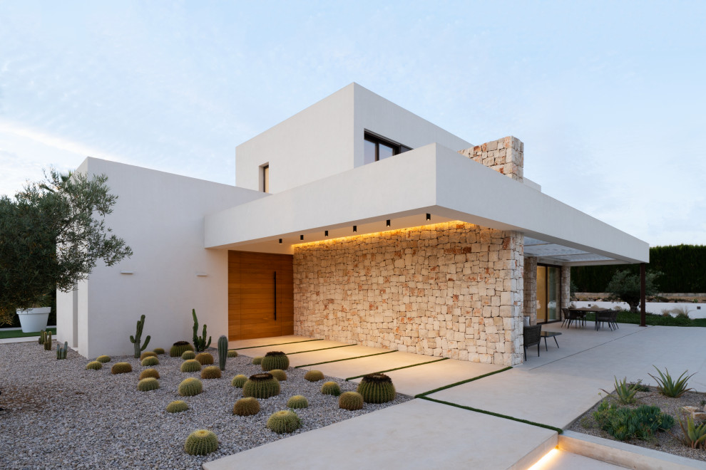 Imagen de terraza in patio delantero With iluminación, losas de hormigón, pérgola and barandilla de varios materiales