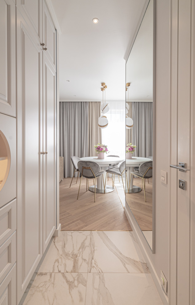 Small classic open plan dining room in London with medium hardwood flooring.