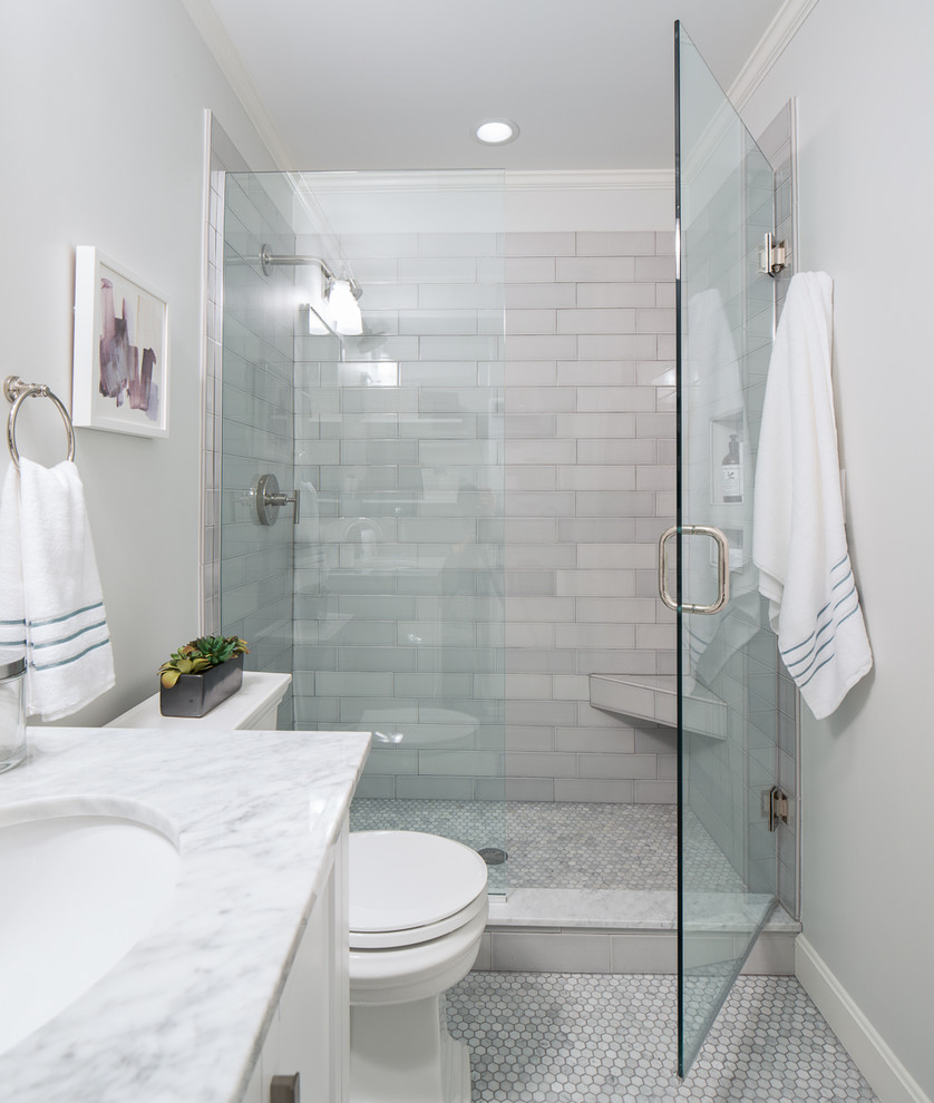 Small contemporary master bathroom in Boston with shaker cabinets, white cabinets, an alcove shower, a one-piece toilet, mosaic tile, white walls, an undermount sink, marble floors, marble benchtops, grey floor, a hinged shower door and grey benchtops.