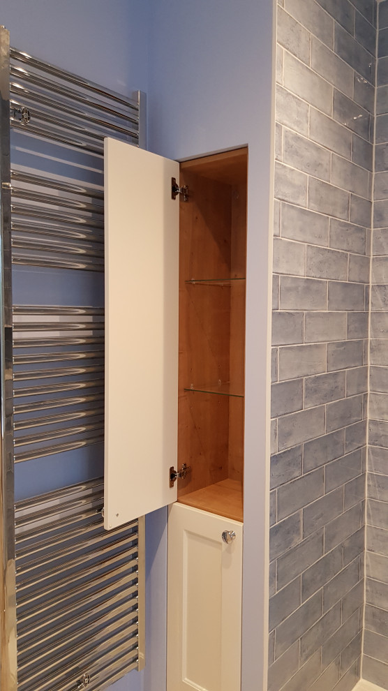 Small contemporary shower room bathroom in Kent with shaker cabinets, white cabinets, a walk-in shower, a one-piece toilet, blue tiles, ceramic tiles, blue walls, vinyl flooring, an integrated sink, engineered stone worktops, grey floors, an open shower, white worktops, a single sink, a built in vanity unit and a drop ceiling.