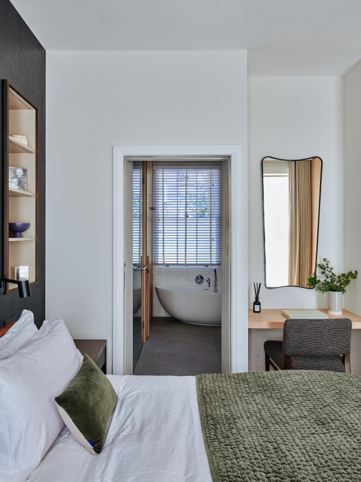 Photo of a medium sized contemporary master bedroom in London.