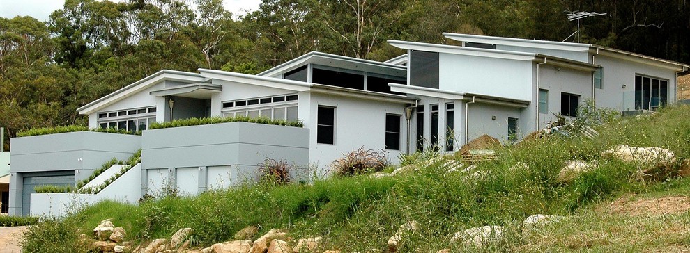 Large modern split-level white exterior in Sydney.