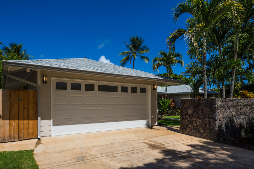 Mid-sized beach style attached two-car garage in Hawaii.