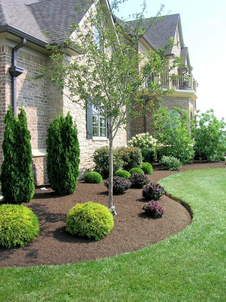 Design ideas for a mid-sized partial sun front yard stone landscaping in Other.