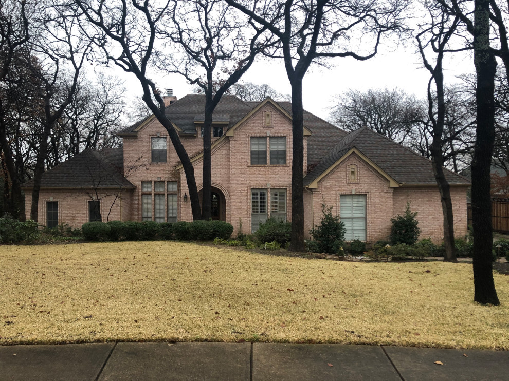 White brick with dark gray/black fascia and soffits.