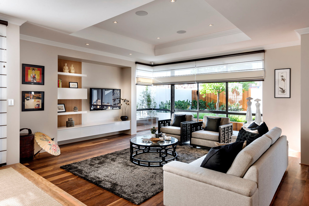 Inspiration for a large asian open concept living room in Perth with beige walls, no fireplace and a wall-mounted tv.