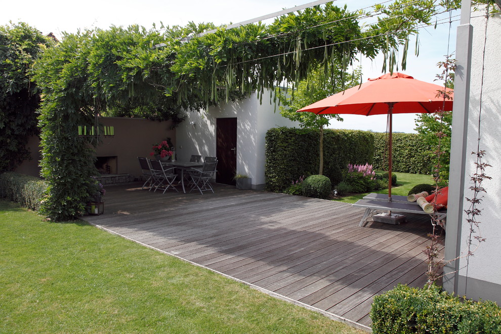 Design ideas for a large contemporary backyard patio in Nuremberg with decking and no cover.