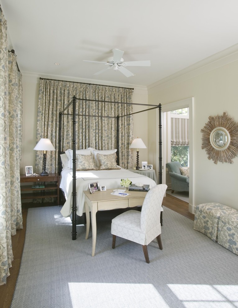 Traditional master bedroom in Charleston with beige walls.