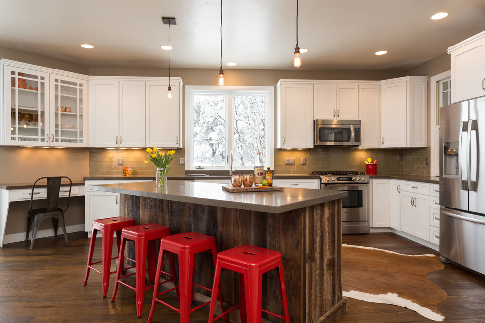 Inspiration for a country u-shaped kitchen in Salt Lake City with shaker cabinets, white cabinets, green splashback, subway tile splashback, stainless steel appliances, dark hardwood floors and with island.