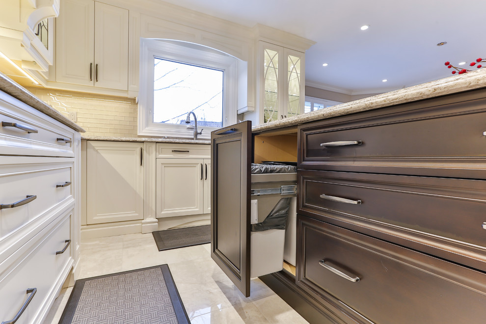 Example of a transitional kitchen design in Toronto