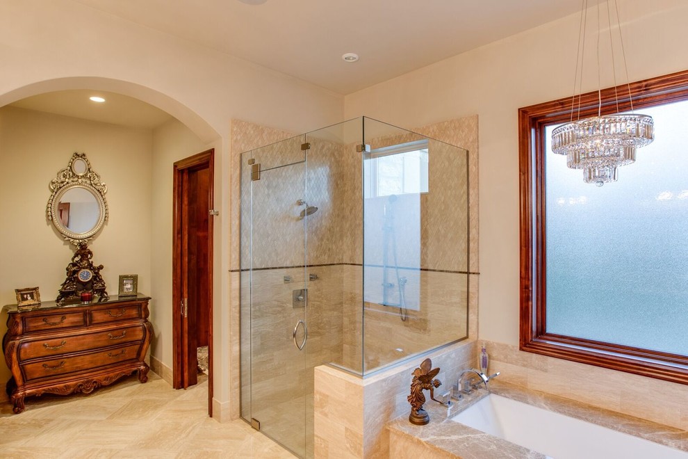 Design ideas for a large traditional master bathroom with beaded inset cabinets, medium wood cabinets, an undermount tub, a curbless shower, a one-piece toilet, beige tile, stone tile, beige walls, marble floors, an undermount sink, marble benchtops, beige floor and a hinged shower door.