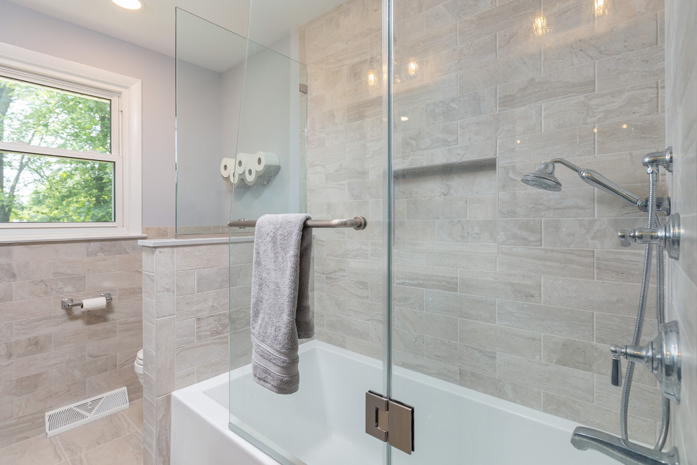 Photo of a mid-sized contemporary bathroom in Philadelphia with raised-panel cabinets, grey cabinets and granite benchtops.