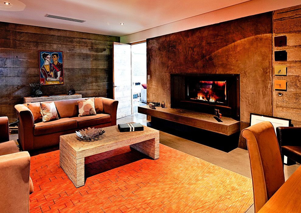 Mid-sized contemporary formal enclosed living room in Perth with a standard fireplace, a concrete fireplace surround and multi-coloured walls.