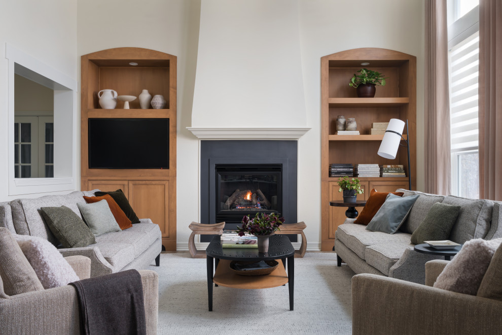 Example of a transitional living room design in Denver