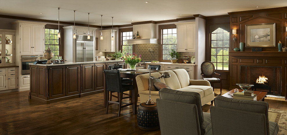 Design ideas for an expansive traditional single-wall open plan kitchen in Houston with raised-panel cabinets, white cabinets, quartz benchtops, brown splashback, porcelain splashback, stainless steel appliances, an undermount sink, dark hardwood floors, with island and brown floor.