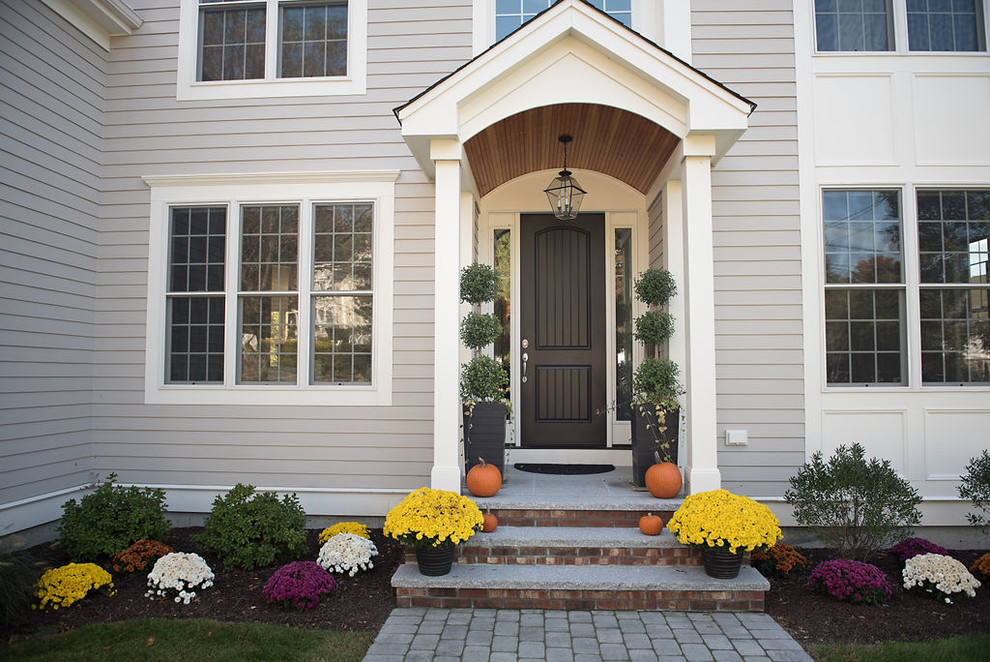 Example of a transitional home design design in Boston