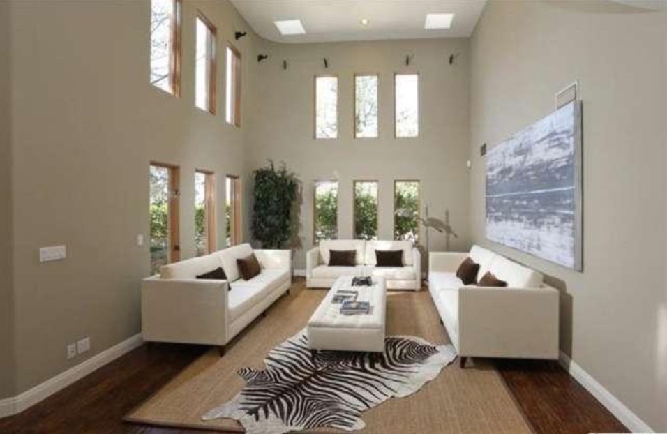 Photo of a large formal open concept living room in Los Angeles with beige walls and no fireplace.