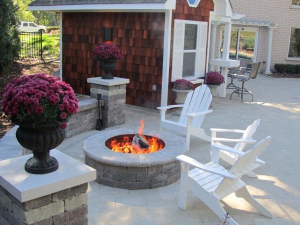 Design ideas for a mid-sized traditional backyard patio in Salt Lake City with a fire feature, concrete pavers and no cover.