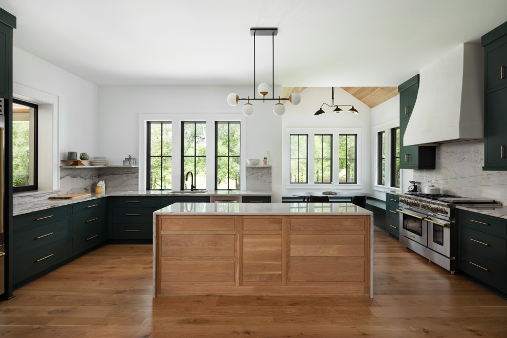 Inspiration for a country u-shaped kitchen in Other with an undermount sink, flat-panel cabinets, black cabinets, grey splashback, stone slab splashback, stainless steel appliances, medium hardwood floors, with island, brown floor and grey benchtop.