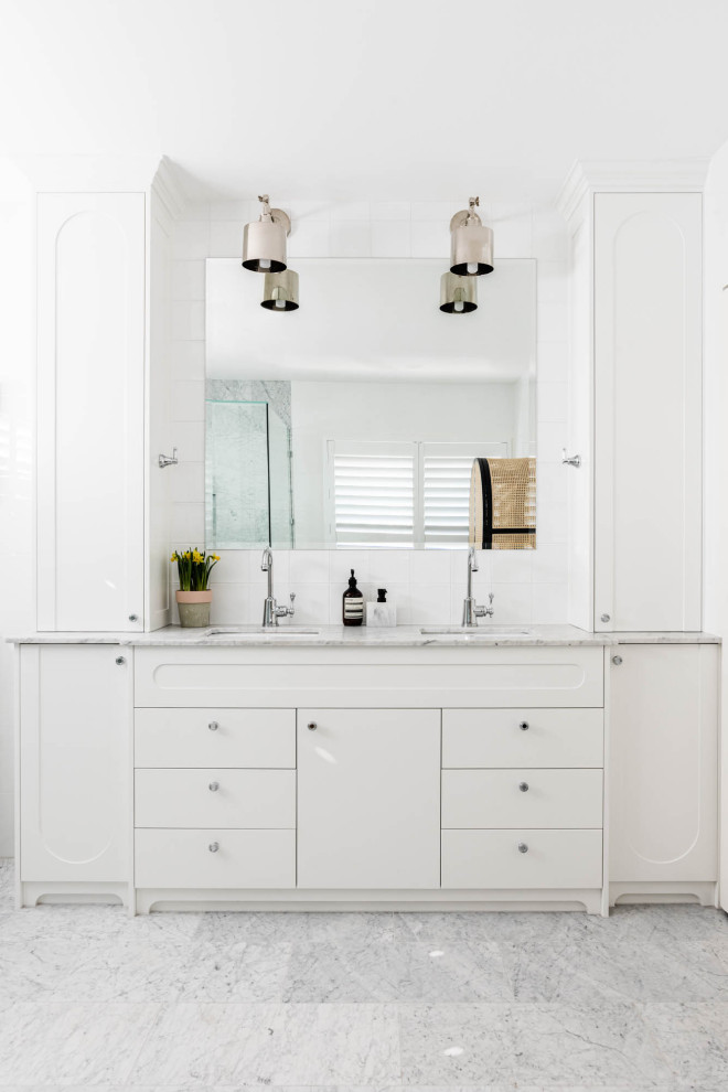Design ideas for a modern bathroom in Brisbane with recessed-panel cabinets, white cabinets, white walls, marble benchtops, a double vanity and a built-in vanity.