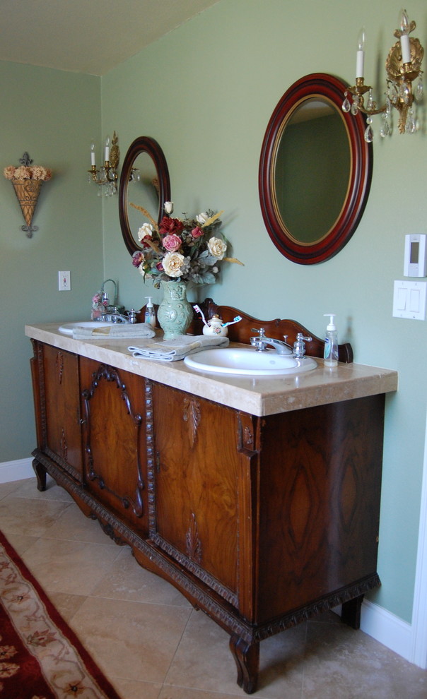 Traditional bathroom in Portland with a drop-in sink, dark wood cabinets and recessed-panel cabinets.