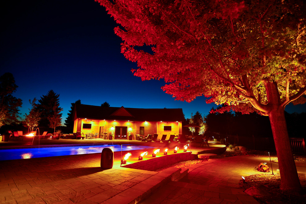 Inspiration for a large contemporary backyard concrete paver and rectangular landscaping.