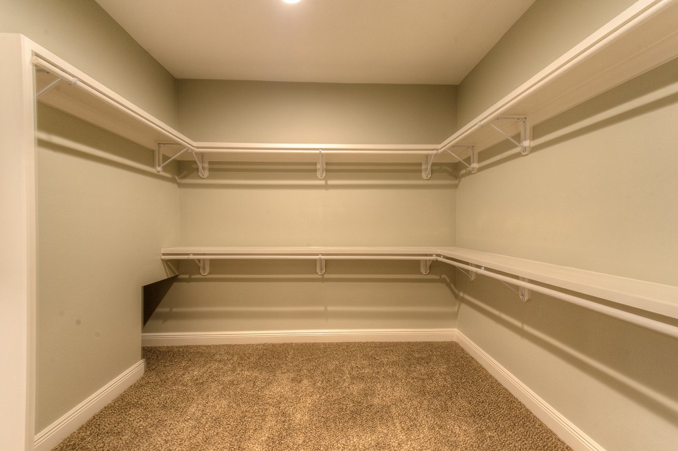 Example of a transitional closet design in Miami