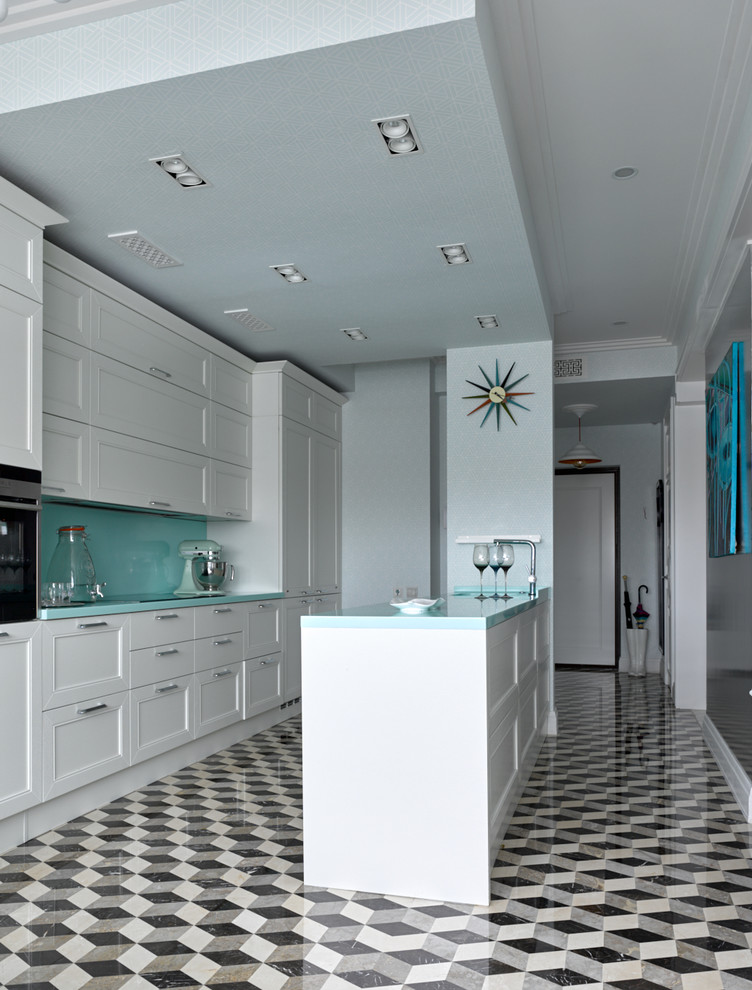 Photo of an eclectic single-wall kitchen in Moscow with an undermount sink, recessed-panel cabinets, white cabinets, stainless steel appliances, marble floors, with island and multi-coloured floor.