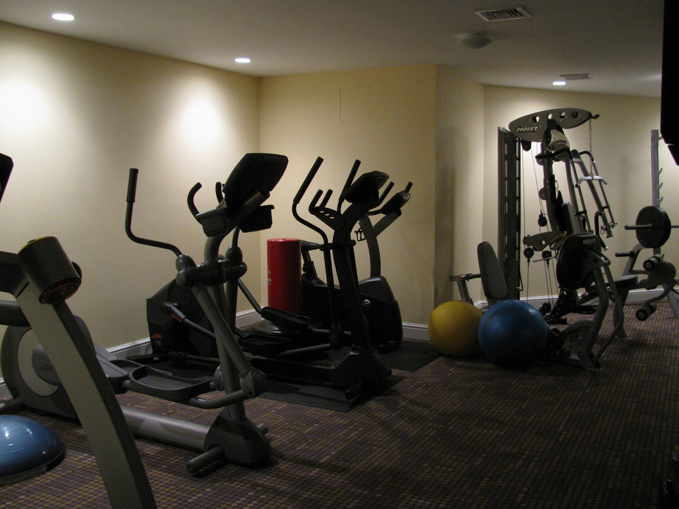 Large traditional multipurpose gym in Boston with beige walls, carpet and multi-coloured floor.