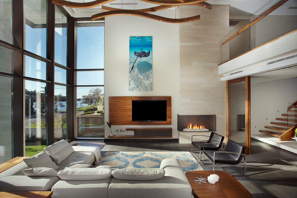 Photo of a contemporary open concept living room in Perth with beige walls, a corner fireplace, a stone fireplace surround and a wall-mounted tv.