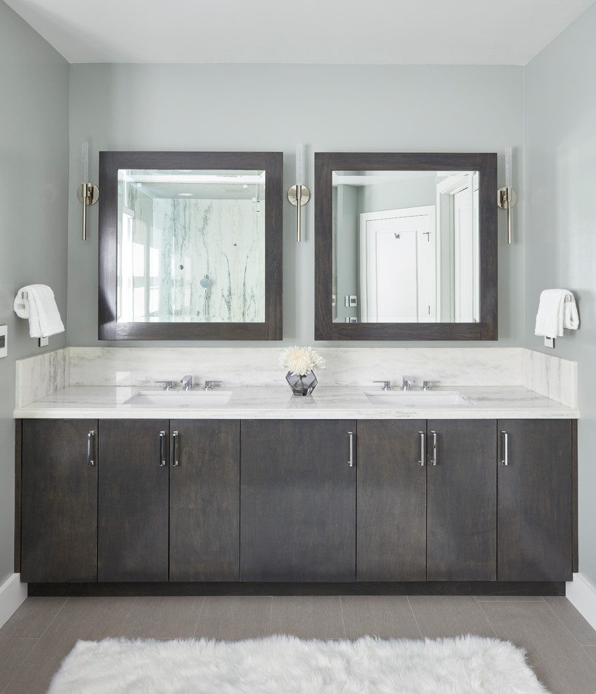 This is an example of a large transitional master bathroom in Los Angeles with flat-panel cabinets, dark wood cabinets, a double shower, marble, green walls, porcelain floors, an undermount sink, engineered quartz benchtops, grey floor and a hinged shower door.