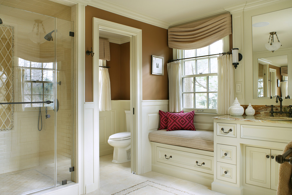 Photo of a traditional bathroom in New York with an alcove shower, brown walls and an enclosed toilet.