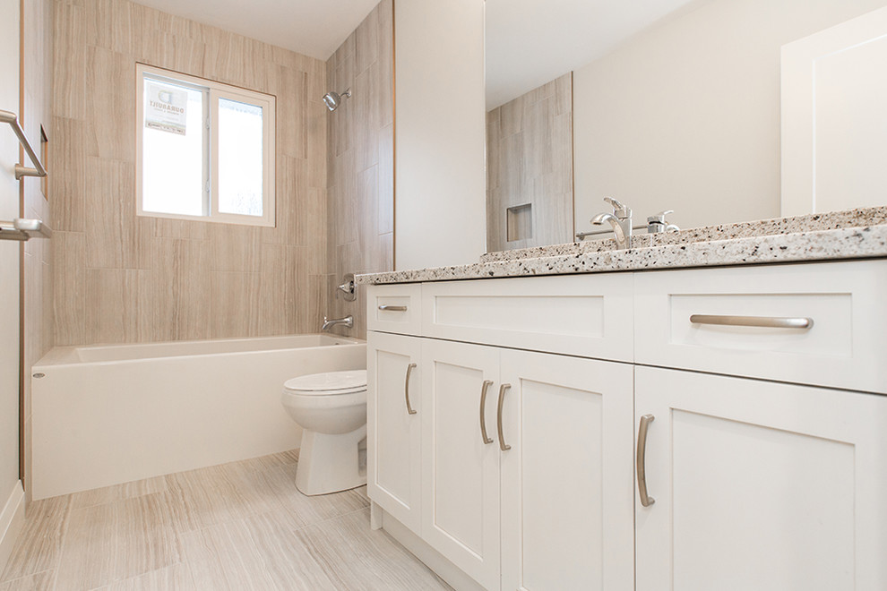 Example of a transitional home design design in Edmonton