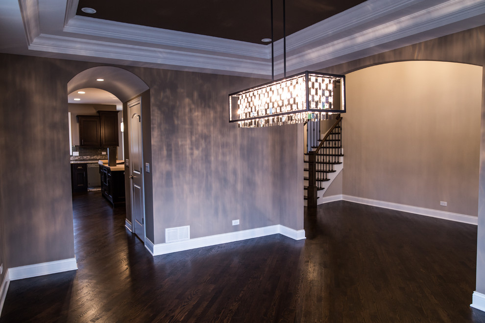 Example of a mid-sized transitional dark wood floor home design design in Chicago with brown walls and no fireplace