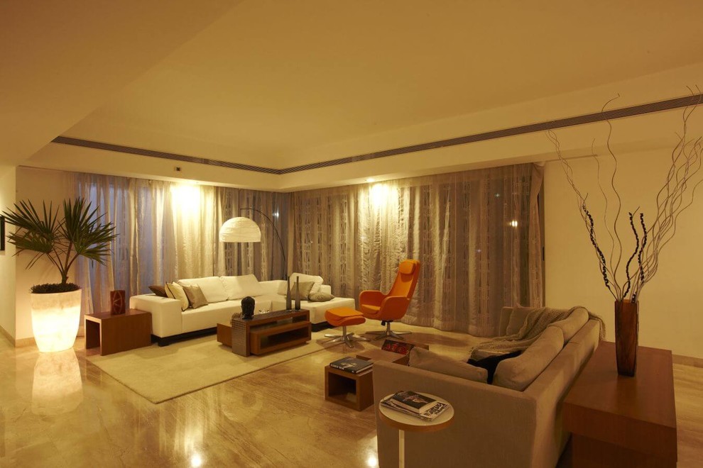 Design ideas for a large contemporary living room in Pune.
