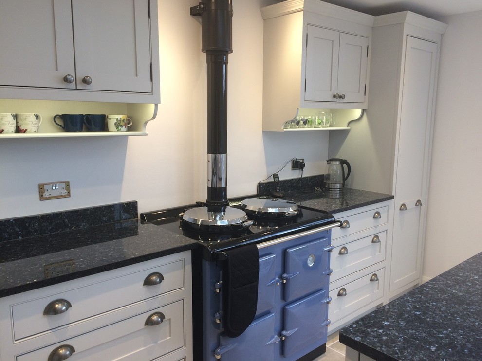 Mid-sized traditional kitchen in Cheshire with beaded inset cabinets, grey cabinets, granite benchtops and with island.