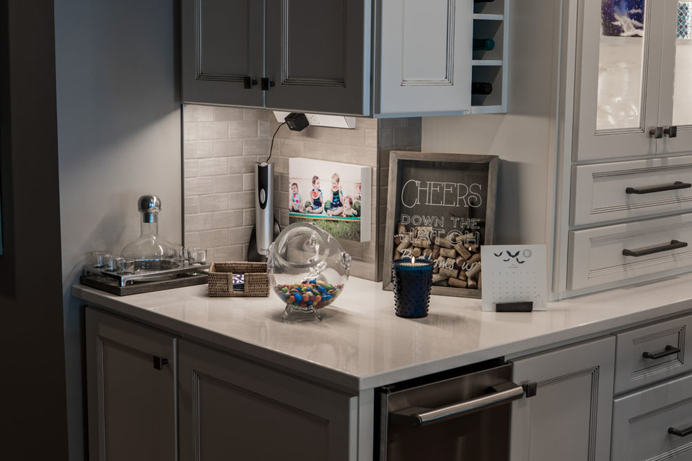 Inspiration for a mid-sized transitional eat-in kitchen remodel with shaker cabinets, white cabinets, quartz countertops, stainless steel appliances and an island